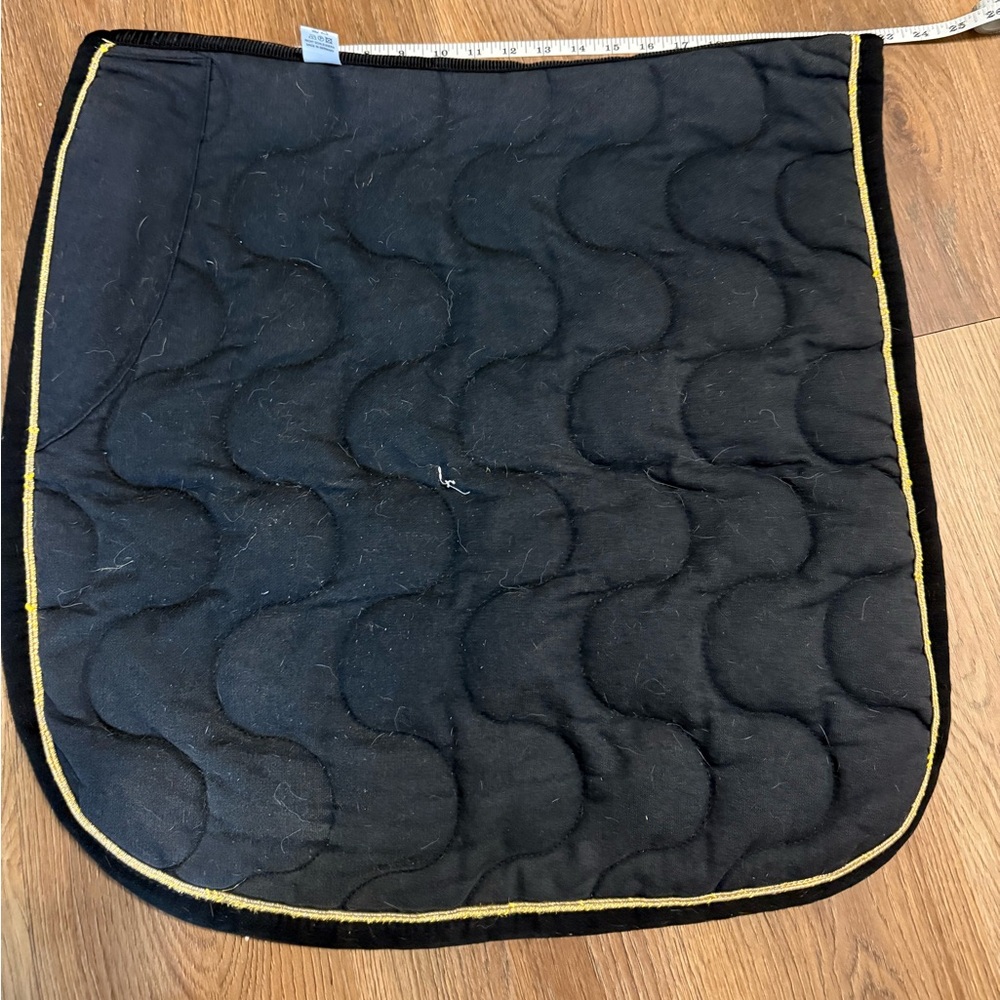 Black dressage saddle pad with gold trim